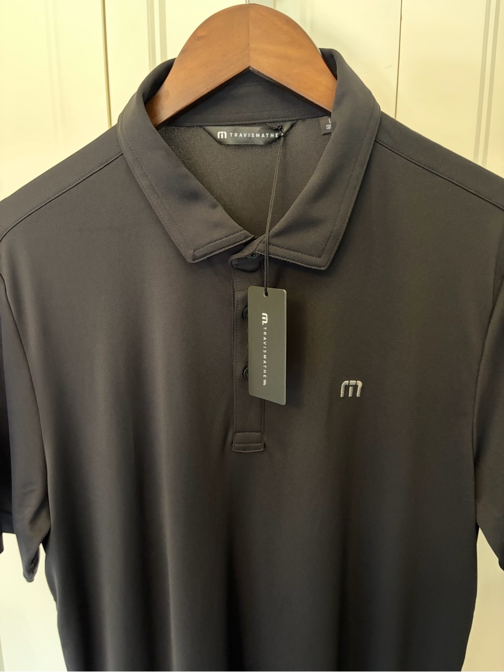 Travis Mathew Men's Black Performance Golf Polo with Subtle Logo